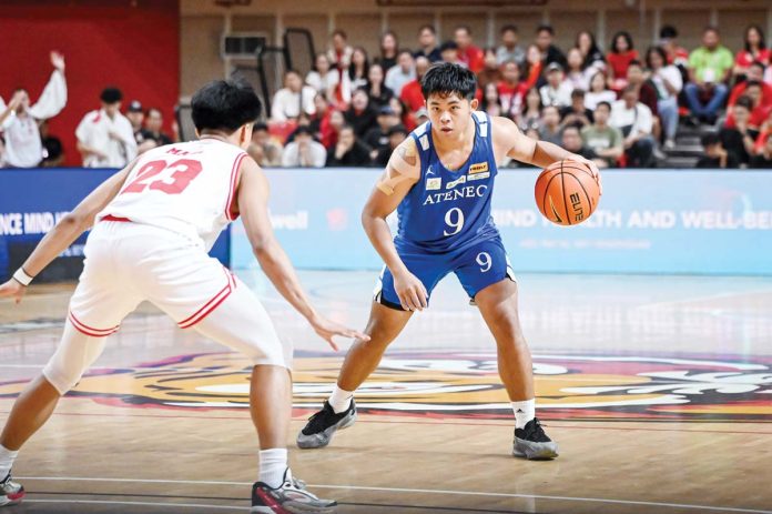 Ateneo de Manila University Blue Eagles’ Jared Bahay dribbles the ball against the defense of University of the East Red Warriors’ Reiner Maga. UAAP PHOTO