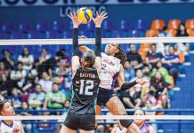 Choco Mucho Flying Titans’ Cherry Nunag smashes the ball against the defense of Galeries Tower Highrisers’ Roselle Baliton. PVL PHOTO