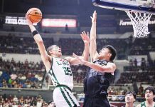 De La Salle University Green Archers’ Michael Phillips tries to score against the defense of University of the Philippines Fighting Maroons’ Jacob Bayla. UAAP PHOTO