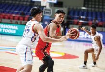 NorthPort Batang Pier’s Arvin Tolentino protects the ball from the defense of NLEX Road Warriors’ Xyrus Torres. PBA PHOTO