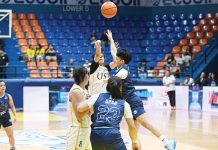 Ilongga Ana Tacatac of University of Santo Tomas Growling Tigresses attempts a three-pointer. UAAP PHOTO