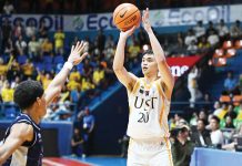 University of Santo Tomas Growling Tigers’ Amiel Acido pulls up for a three-pointer against the defense of Adamson University Falcons’ AJ Fransman. UAAP PHOTO