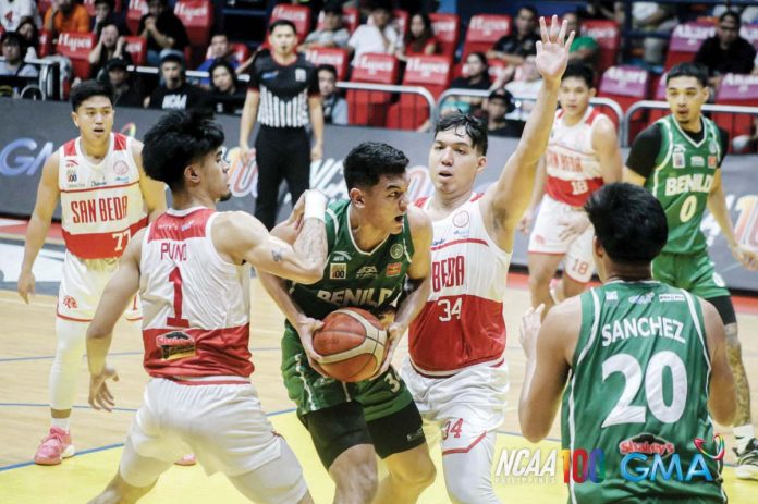 College of St. Benilde Blazers’ Allen Liwag protects the ball from the defense of San Beda University Red Lions’ Jomel Puno and John Bismarck Lina. Photo courtesy of NCAA/GMA Sports