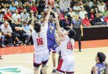 TNT Tropang Giga’s Rondae Hollis-Jefferson shoots against the defense of Barangay Ginebra San Miguel Kings’ Ralph Cu and Benedict Adamos. PBA PHOTO