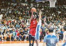 Barangay Ginebra San Miguel Kings’ Justin Brownlee shoots over the defense of TNT Tropang Giga's Rey Nambatac. PBA PHOTO