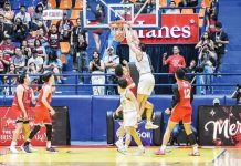 University of the Philippines Fighting Maroons’ Quentin Millora-Brown scores on a two-handed dunk. UAAP PHOTO