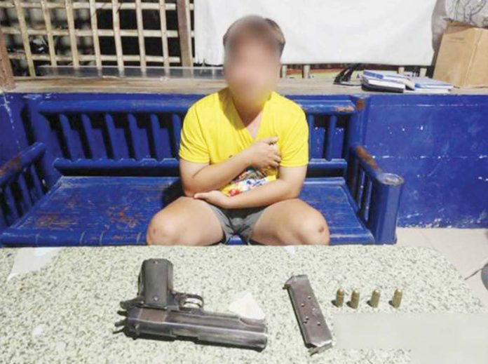 This 18-year-old youth from Badiangan, Iloilo faces charges for possession of an unlicensed firearm. He was arrested on Monday night, November 18 by Badiangan policemen. PHOTOS FROM IPPO