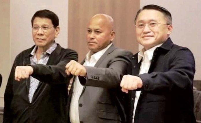 Four committees of the House of Representatives officially recommended that former president Rodrigo Duterte (1st from left) should be charged for crimes against humanity over the killings of about 30,000 people in the name of his war on drugs, and that his allies, senators Ronald dela Rosa (center) and Bong Go, should also be charged with him.