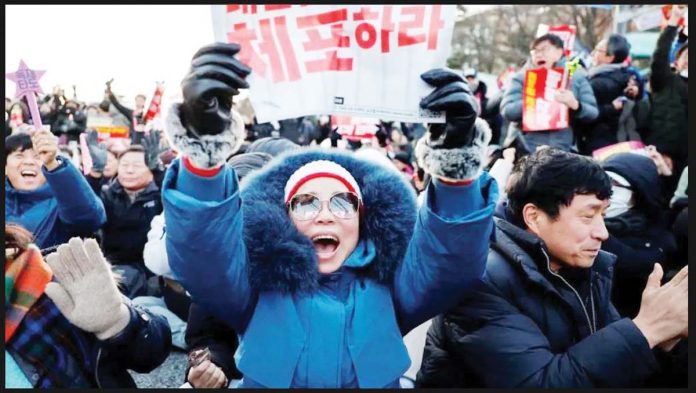 Tens of thousands of people had come out in protest since President Yoon Suk Yeol's short-lived martial law order. GETTY IMAGES