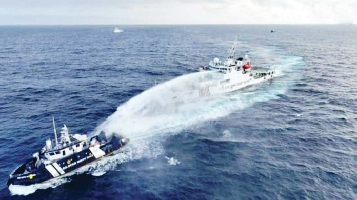 Using water cannon, a Chinese ship harasses a Philippine vessel conducting a routine maritime patrol within Bajo de Masinloc in the West Philippine Sea on Wednesday morning. PHOTO COURTESY OF PCG, NTF-WPS