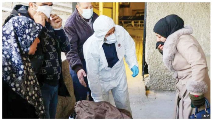 Relatives retrieved some of the bodies found at Harasta hospital in Syria after they were identified. AFP