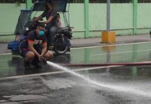 Bago City Fire Station personnel are currently cleaning the city's main streets affected by the ash fall from Mount Kanlaon's eruption yesterday afternoon, December 9. Photo courtesy of The Citybridge