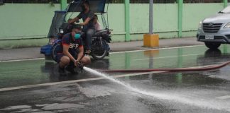 Bago City Fire Station personnel are currently cleaning the city's main streets affected by the ash fall from Mount Kanlaon's eruption yesterday afternoon, December 9. Photo courtesy of The Citybridge