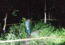 Police investigates the area in Barangay Omio, Lemery, Iloilo where Ney Palma Parcon was found dead early Monday morning, Dec. 16, 2024. K5 NEWS FM SARA DIGITAL PHOTO