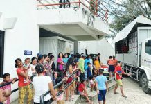 The Department of Social Welfare and Development distributes food packs to residents of La Castellana, Negros Occidental displaced by the eruption of Kanlaon Volcano. The eruption affected a total of 7,294 individuals from eight La Castellana barangays. SERBISYO AÑEJO/FACEBOOK PHOTO