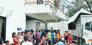 The Department of Social Welfare and Development distributes food packs to residents of La Castellana, Negros Occidental displaced by the eruption of Kanlaon Volcano. The eruption affected a total of 7,294 individuals from eight La Castellana barangays. SERBISYO AÑEJO/FACEBOOK PHOTO