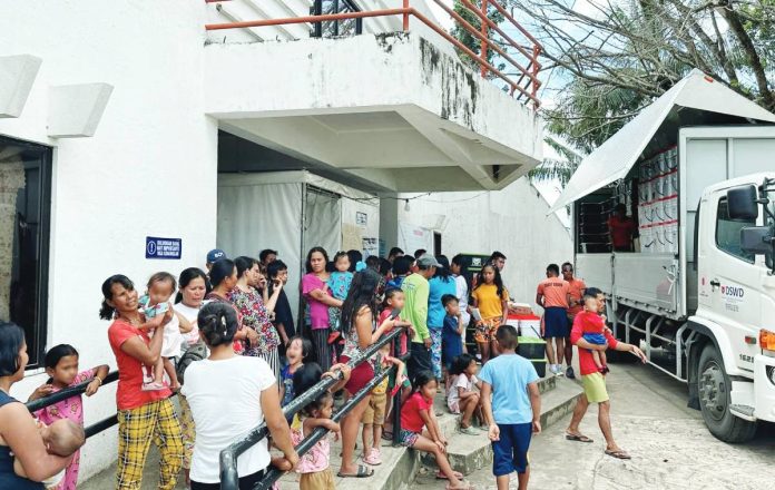 The Department of Social Welfare and Development distributes food packs to residents of La Castellana, Negros Occidental displaced by the eruption of Kanlaon Volcano. The eruption affected a total of 7,294 individuals from eight La Castellana barangays. SERBISYO AÑEJO/FACEBOOK PHOTO