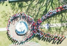 On December 4, the Iloilo Provincial Health Office, in collaboration with the Concepcion local government unit, commemorated World AIDS Day with the theme, “Take the Rights Path.” The event gathered students, teachers, barangay officials, and stakeholders to promote an inclusive approach to combating HIV/AIDS. Photo shows the participants forming a large human red ribbon. The red ribbon is a global symbol of awareness and support for people living with HIV/AIDS. Photo from Iloilo Provincial Health Office Facebook Page