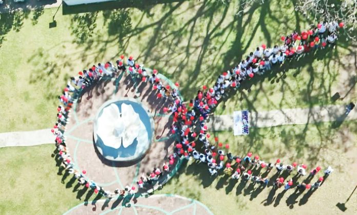 On December 4, the Iloilo Provincial Health Office, in collaboration with the Concepcion local government unit, commemorated World AIDS Day with the theme, “Take the Rights Path.” The event gathered students, teachers, barangay officials, and stakeholders to promote an inclusive approach to combating HIV/AIDS. Photo shows the participants forming a large human red ribbon. The red ribbon is a global symbol of awareness and support for people living with HIV/AIDS. Photo from Iloilo Provincial Health Office Facebook Page