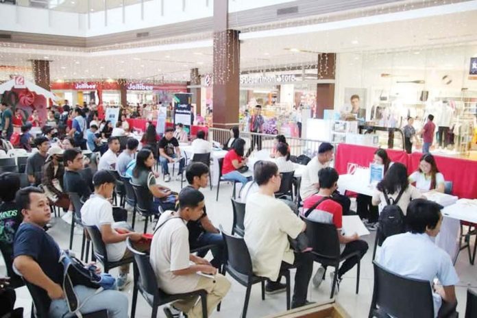 Job applicants queue up at a job fair held at a mall in Roxas City. FILE PHOTO FROM MAYOR RONNIE DADIVAS FB PAGE