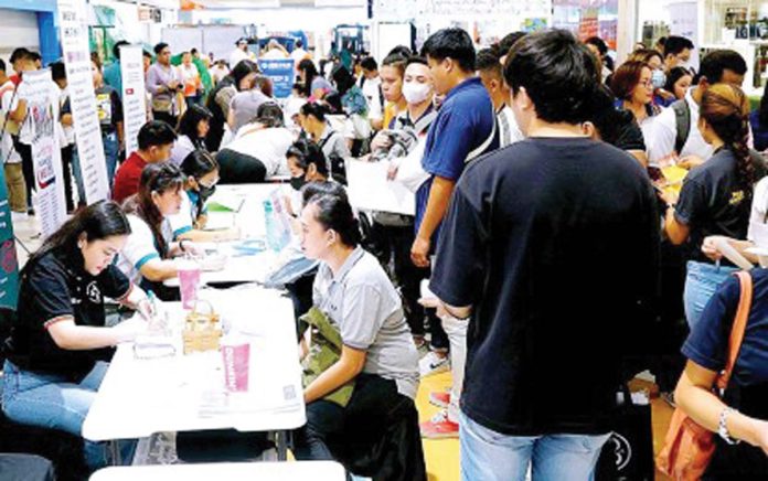 Job applicants queue up at a job fair held at a mall in Marikina City. Latest data from the Philippine Statistics Authority showed that the country's employment rate further went up to 96.3 percent in September 2024 from 95.5 percent in September 2023. PNA PHOTO BY BEN BRIONES