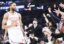 New York Knicks’ Mikal Bridges gestures after making a three-pointer.