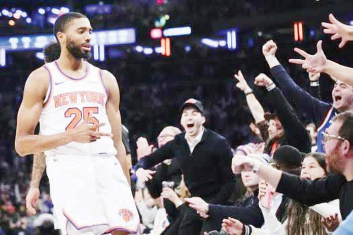 New York Knicks’ Mikal Bridges gestures after making a three-pointer.