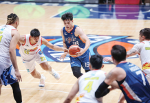 Meralco Bolts’ Kier John Quinto protects the ball from the defense of Rain or Shine Elasto Painters’ Jhonard Clarito. PBA PHOTO