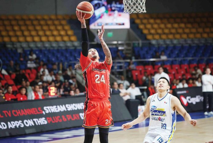 NorthPort Batang Pier’s Joshua Munzon scores on an easy layup. PBA PHOTO