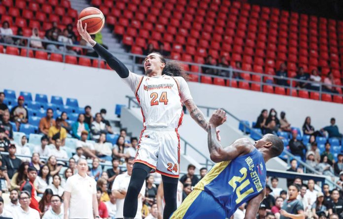 NorthPort Batang Pier’s Joshua Munzon stretches for a layup. PBA PHOTO