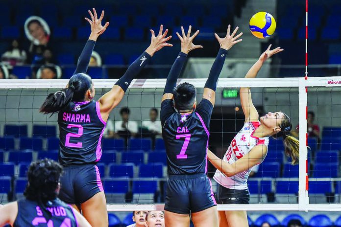 Petro Gazz Angels’ Myla Pablo tries to score against the defense of Akari Power Chargers’ Kamille Cal. PVL PHOTO