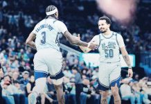 Orlando Magic’s Cole Anthony gets a high-five from teammate Kentavious Caldwell-Pope after his game-winning layup. PHOTO COURTESY OF ORLANDO MAGIC