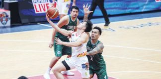 Rain or Shine Elasto Painters’ Adrian Nocum eludes the defense of Terrafirma Dyip’s Vic Manuel for a layup. PBA PHOTO