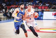 TNT Tropang Giga’s Calvin Oftana protects the ball from the defense of Magnolia Chicken Timplados Hotshots’ Jerrick Ahanmisi. PBA PHOTO