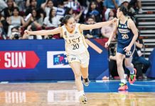 University of Santo Tomas Growling Tigresses’ Karylle Sierba gestures after hitting a huge basket against the National University Lady Bulldogs. UAAP PHOTO