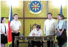 MUCH SCRUTINIZED. President Ferdinand Marcos Jr. signs the P6.326-trillion national budget for 2025 in a ceremony in Malacañang on Dec. 30, 2024. MARIANNE BERMUDEZ, PHILIPPINE DAILY INQUIRER