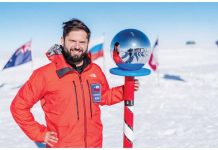 Chilean President Gabriel Boric poses next to the Ceremonial Pole Globe during his historic visit to the South Pole in Antarctica, on January 3, 2025. REUTERS