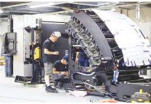 Technicians inspect a printing machine for ballots and other forms for the 2025 midterm polls at the National Printing Office in Quezon City. PNA