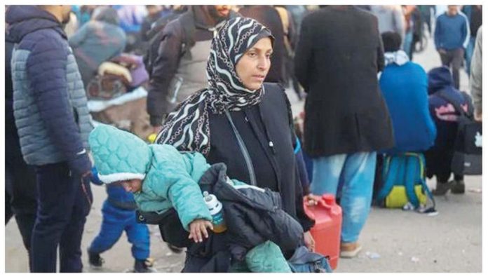 Palestinians wait to be allowed to go to their homes in the Gaza Strip. GETTY IMAGES