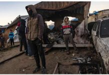 People inspect damage after an Israeli air strike reportedly killed 11 people at a tent camp for displaced families in al-Mawasi, southern Gaza. Israel has attacked heavily populated areas, saying Hamas militants hide among displaced civilians. EPA