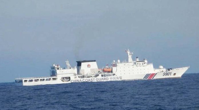 The Philippine Coast Guard’s BRP Cabra continues to monitor the movements of China Coast Guard vessel 5901, also called “The Monster,” in the country’s exclusive economic zone off the coast of Zambales. PHOTO FROMCOMMODORE JAY TARRIELA X ACCOUNT