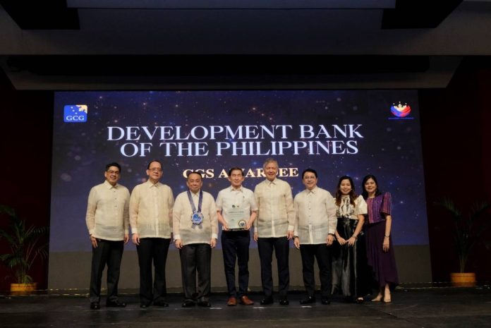 DBP Chairman Philip G. Lo (fourth from left) receives the Governance Commission for GOCCs (GCG) award bestowed on the Bank for scoring the second highest rating in the Corporate Governance Scorecard. Also shown in photo are (from left): GCG Commissioner Atty. Brian Keith F. Hosaka, GCG Chairperson Atty. Marius P. Corpus, Executive Secretary Lucas P. Bersamin, DBP President and Chief Executive Officer Michael O. de Jesus, DBP Director Roberto V. Antonio, DBP Corporate Secretary Atty. Maria Katrina L. Infante, and GCG Commissioner Atty. Geraldine Marie B. Berberabe-Martinez.