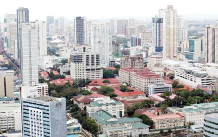 The Department of Finance and the International Monetary Fund are optimistic that the Philippine economic growth will accelerate to over 6 percent this year and in 2026. Photo shows high-rise buildings as seen from Torre de Manila on Jan. 14, 2025. PNA PHOTO BY YANCY LIM