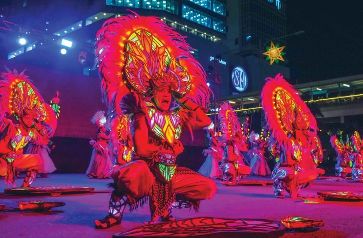 Thousands of tourists trooped to Iloilo City to witness the world-class Dinagyang Festival 2025 with the Ati tribes competition as its grand finale on Sunday, January 26, 2025. Other festival highlights were ILOmination Philippine Light Festival on Jan. 24 and Kasadyahan sa Kabanwahanan competition on Jan. 25. Photo shows a contingent performing at SM City Iloilo, the premier venue and main judging area for ILOmination.