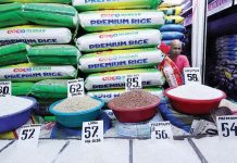 Rice vendor Eddie Pascual waits for customers at Marikina Public Market on Monday, Jan. 6, 2025. The Department of Agriculture says it will announce “very soon” the maximum suggested retail price for imported rice to help lower prices. INQUIRER.NET/GRIG C. MONTEGRANDE PHOTO