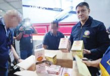 Bureau of Internal Revenue (BIR) Commissioner Romeo Lumagui Jr. shows some of the confiscated illicit vape products during a raid at the Philippine Vape Festival 2024 on Aug. 18, 2024 in Las Piñas City. BIR PHOTO