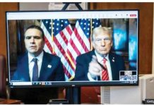 US President-elect Donald Trump and his lawyer Todd Blanche appear virtually on a computer desktop screen from Florida for his sentencing in his Manhattan hush money case. GETTY IMAGES