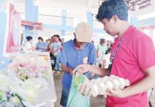 Beneficiaries of Walang Gutom Program from Sebaste, Antique claim their food commodities. DSWD WESTERN VISAYAS/FB PHOTO