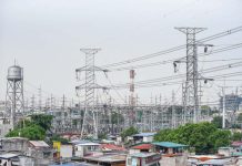 High voltage towers that support transmission lines for electrical power distribution in the Luzon grid is seen from a residential area in Baesa, Quezon City. MARIA TAN, ABS-CBN NEWS PHOTO