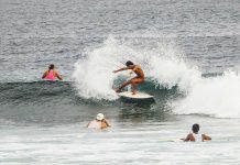 A tourist surfs the waves in General Luna town in Siargao, the surfing capital of the Philippines and home to some of the best beaches in Asia. FERDINANDH CABRERA/AFP PHOTO